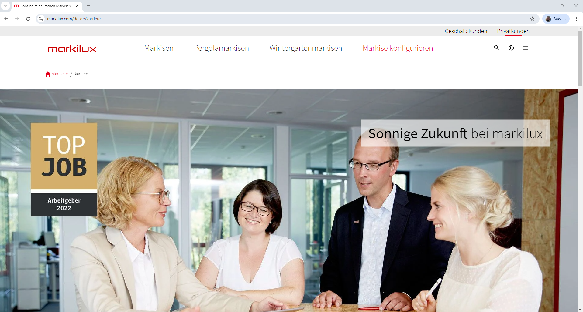Karriereseite von markilux mit dem TOP JOB-Arbeitgebersiegel 2022 im Kopfbild vor einem Team am Besprechungstisch